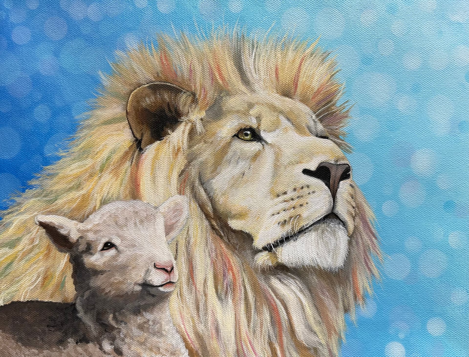 A lion and lamb with blue sky.